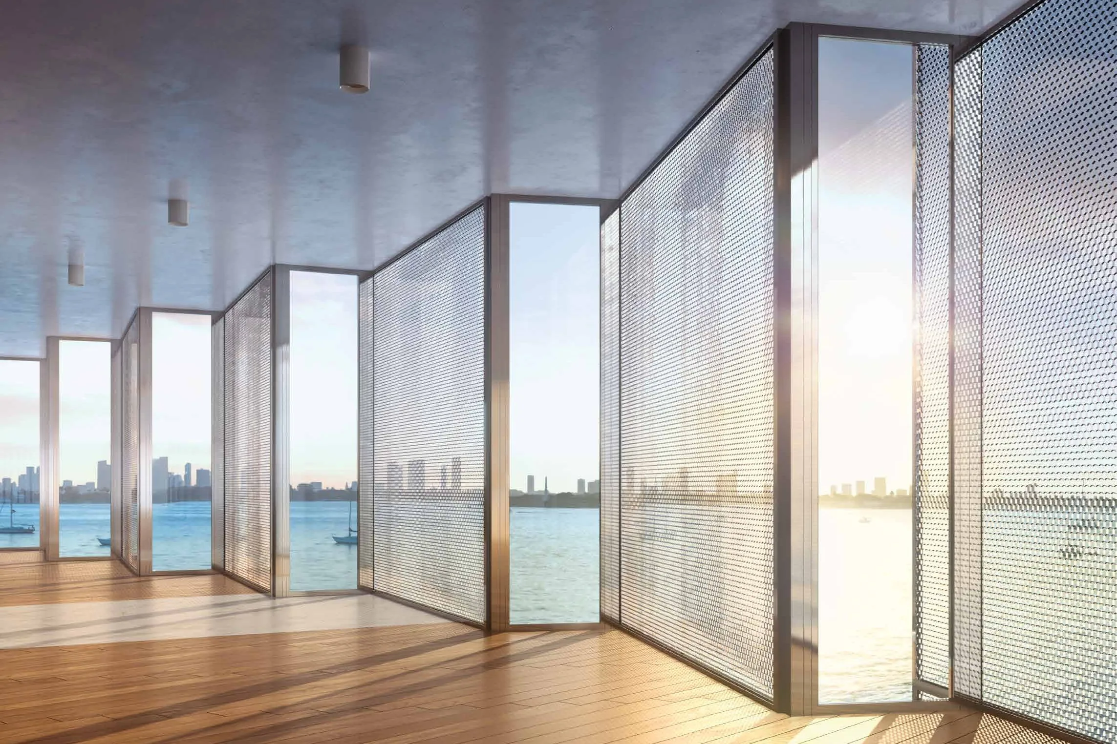 The sawtooth honeycomb screens seen from inside a residence, folding panels of perforated metal filtering light off Biscayne Bay